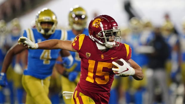 USC wide receiver Drake London runs after catch